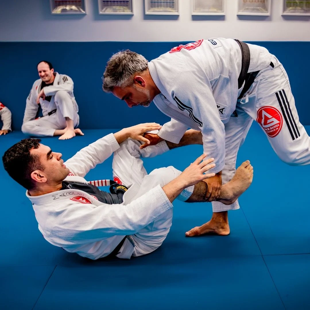 One-on-one private Jiu‑Jitsu training with instructor and student wearing gis