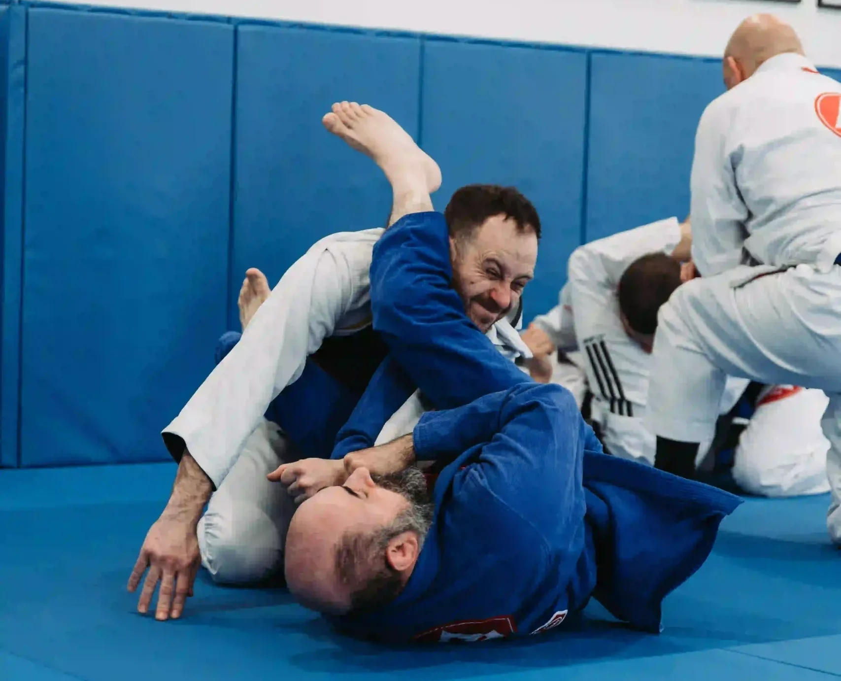 Adults practicing Brazilian Jiu-Jitsu during a GB1 class at Gracie Barra Andover